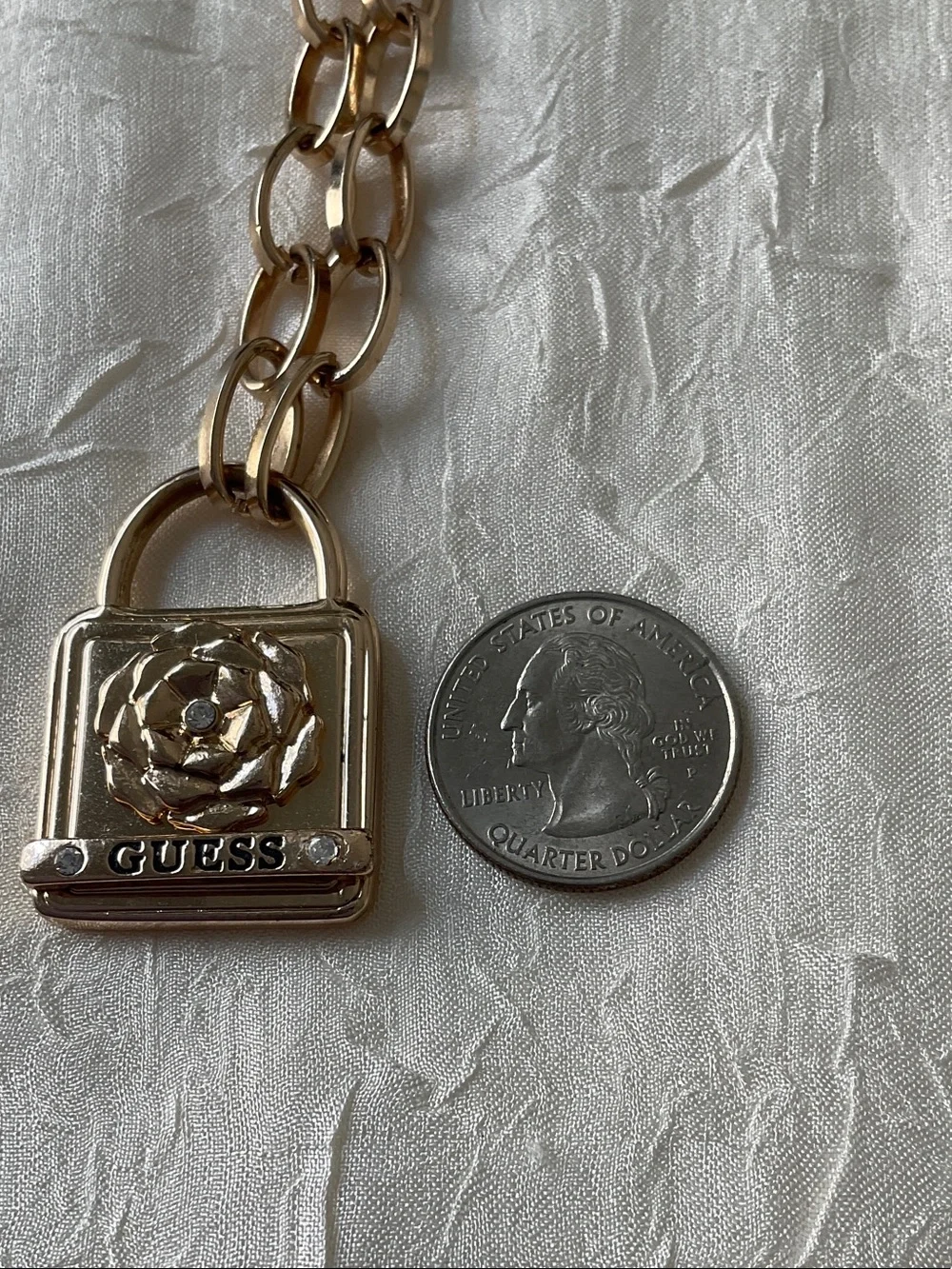 GUESS Gold Padlock Pendant with Floral Accent